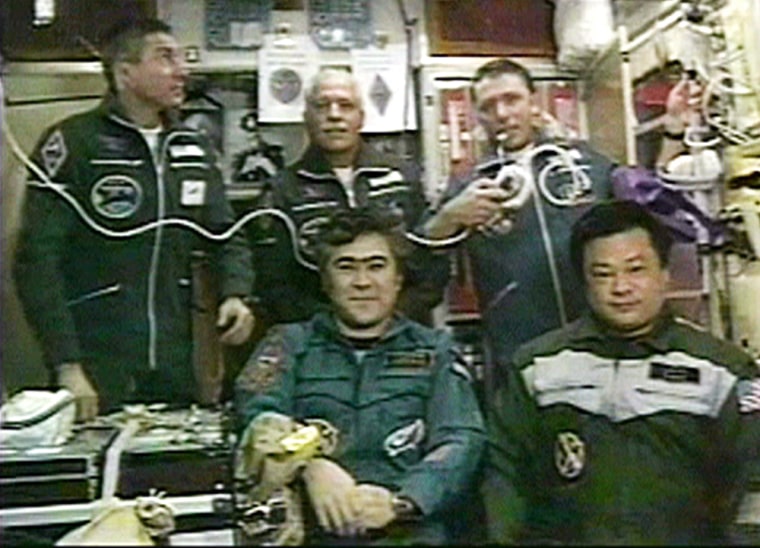 A video grab shows astronauts during a crew conference call from the Internaitonaa Space Station