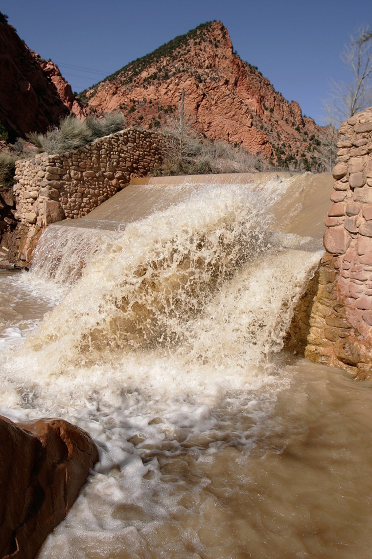 Coal Creek, flowing at about 50 cubic feet per second, heads downstream Monday, April 11, 2005, outside Cedar City, Utah. Next month, the water is expected to flow to 2,000 cubic feet per second or more as the surrounding snowmelt reaches critical mass. (AP Photo/Douglas C. Pizac)