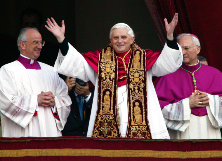 Pope Benedict XVI, Cardinal Joseph Ratsinger of Germany, waves from a balcony of St. Peter's Basilica