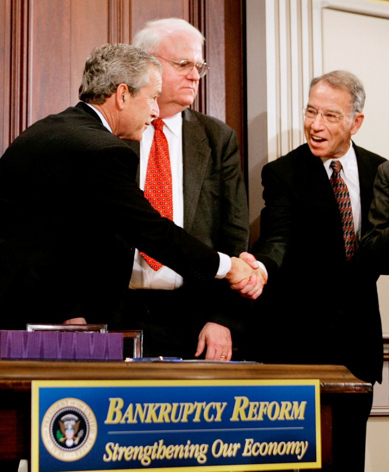 US President George W Bush shakes hands with cosponsors of Bankruptcy Act