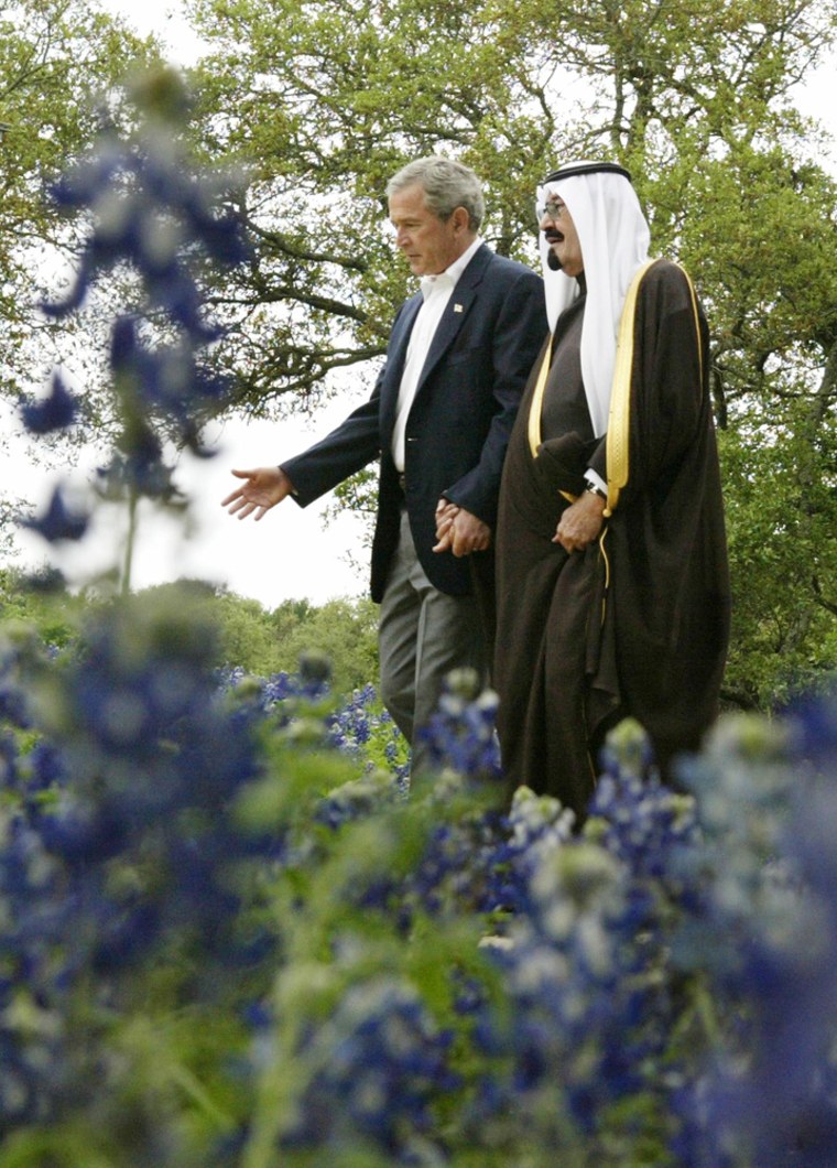 U.S. President George W. Bush walks with Saudi Arabia's Crown Prince Abdullah on his ranch in Crawford