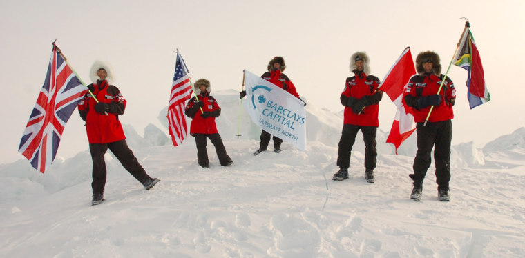 Expedition team members plant their flags at the North Pole, mirroring Robert Peary's 1909 expedition. From left are George Wells, Matty McNair, Tom Avery, Hugh Dale-Harris and Andrew Gerber. 