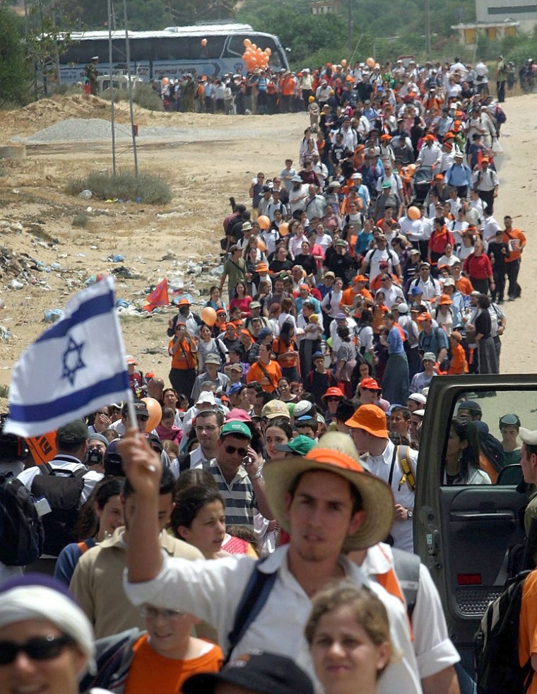 Jewish settlers march before a rally in Gush Katif settlements block in the Gaza Strip