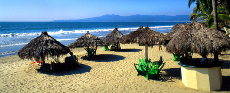 Grass umbrellas on a Puerto Vallarta, Mexico beach