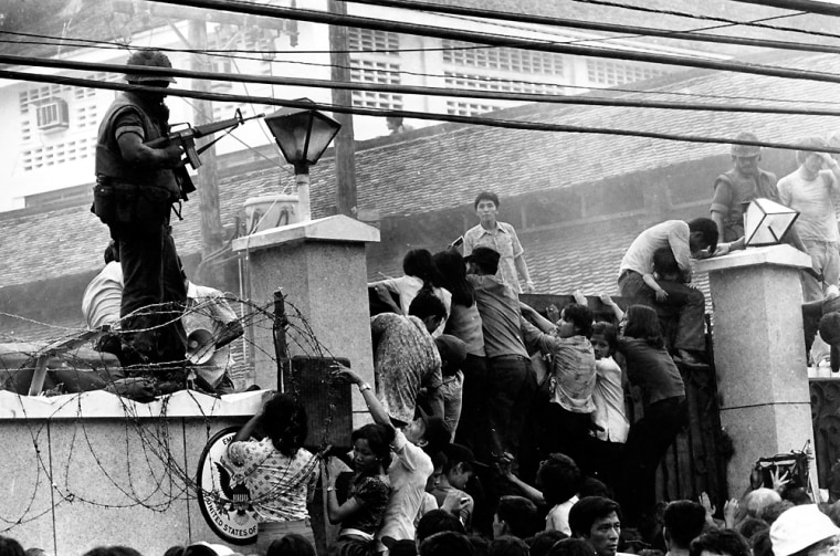 Mobs of Vietnamesee scale the wall of the U.S. Embassy in Saigon, trying to get to the helicopter pickup zone on April 29, 1975.    