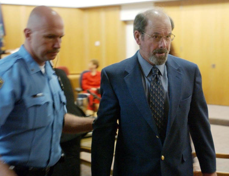 BTK murders suspect Dennis Rader is led out of his arraignment in Wichita Kansas