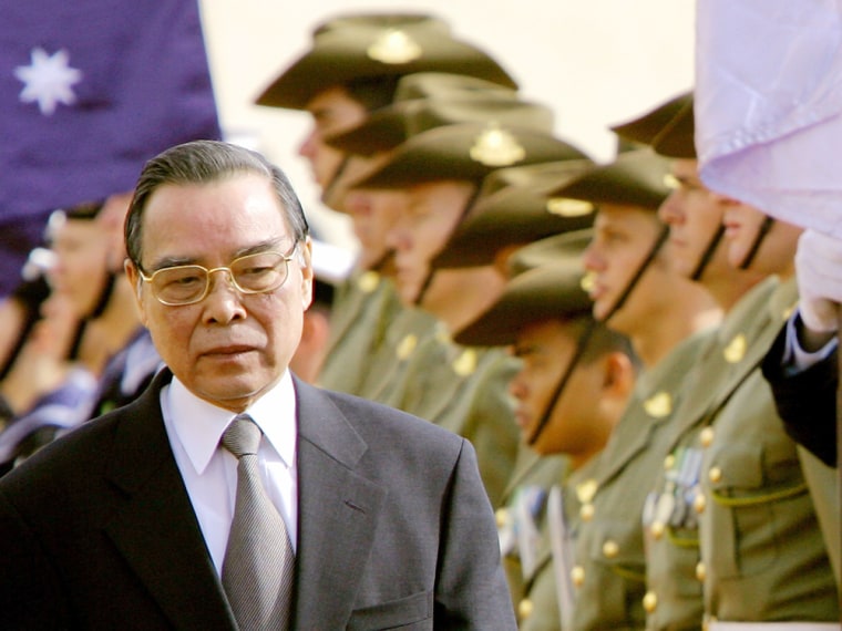 Vietnam PM Khai inspects an honour guard during his arrival at Parliament House in Canberra