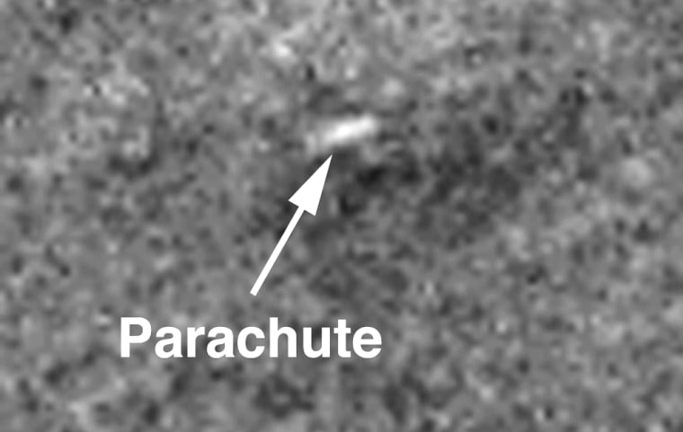 ** FILE ** In these undated images taken by the Mars Global Surveyer and released by Malin Space Science Systems, images of Mars' surface taken after NASA's Mars Polar Lander's disappearance allegedly show a distinct white patch, in photo labeled \"D,\" that appears to be a parachute. A few hundred meters away, scientists noted a dark area in photo \"E,\" possibly made from rocket blast marks, with a tiny white dot in the center that could be the missing lander. The $165 million Polar Lander was headed fora touchdown near Mars' south pole on Dec. 3, 1999, when it suddenly lost contact with Earth. (AP Photo/NASA/JPL/MSSS)