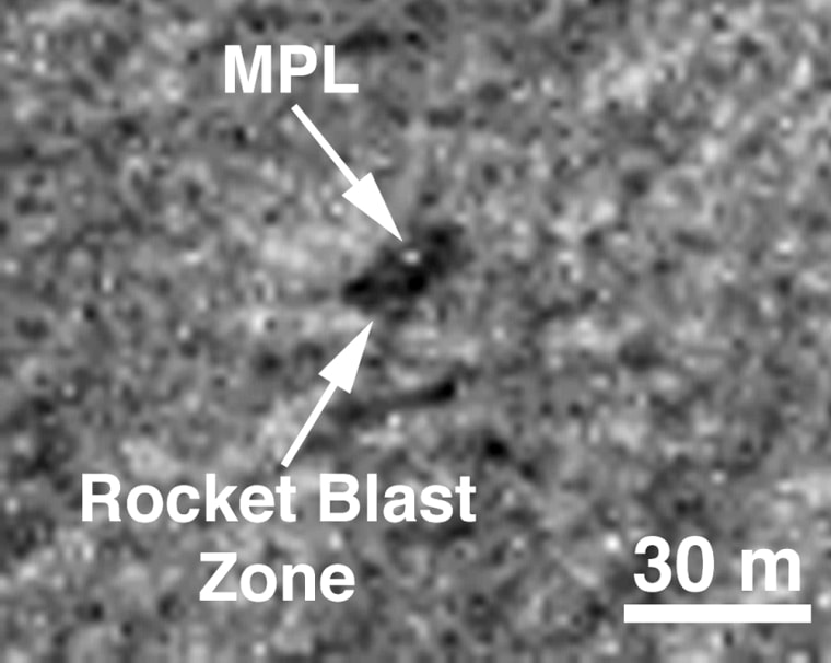 Images taken by the Mars Global Surveyer show a dark area possibly made from rocket blast marks, and a tiny white dot in the center that could be the missing lander. 