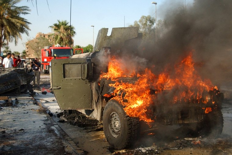 A U.S. military Humvee burns after a car bomb exploded in the al-Mansour neighborhood of Baghdad, Iraq, on Sept. 22, 2004.