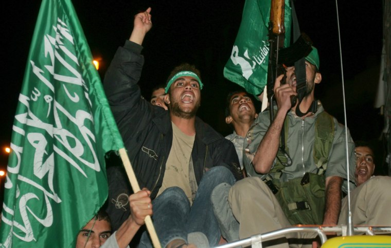 Palestinian Hamas supporters celebrate during a protest in Rafah camp, in southern Gaza Strip