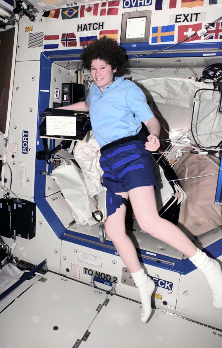 Astronaut Susan Helms, the flight engineer for the international space station's Expedition 2, totes computer hardware on the Destiny laboratory in March 2001. 