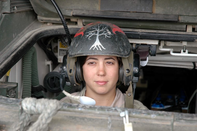 PFC Laura Springer, 20, a medic from Odessa, Texas, is one of the few women who drives the Army's Stryker armored combat vehicle.