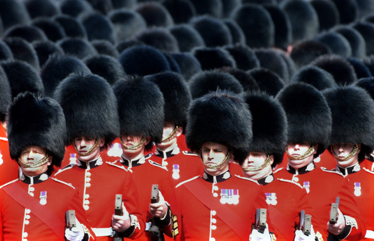 Scots Guards donning bearskin hats take part in a royal procession in London in April, 2002.