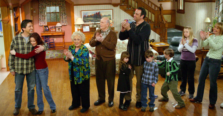 In this photo released by CBS, the cast of \"Everybody Loves Raymond\" applauds at the taping of the final episode of the show at Warner Bros. Studios in Burbank, Calif., on  Jan. 29, 2005. Cast members from left are Ray Romano, Patricia Heaton, Doris Roberts, Peter Boyle, Brad Garrett with his two children, Sullivan Sweeten, Madylin Sweeten and Monica Horan. (AP Photo/CBS, Richard Cartwright)