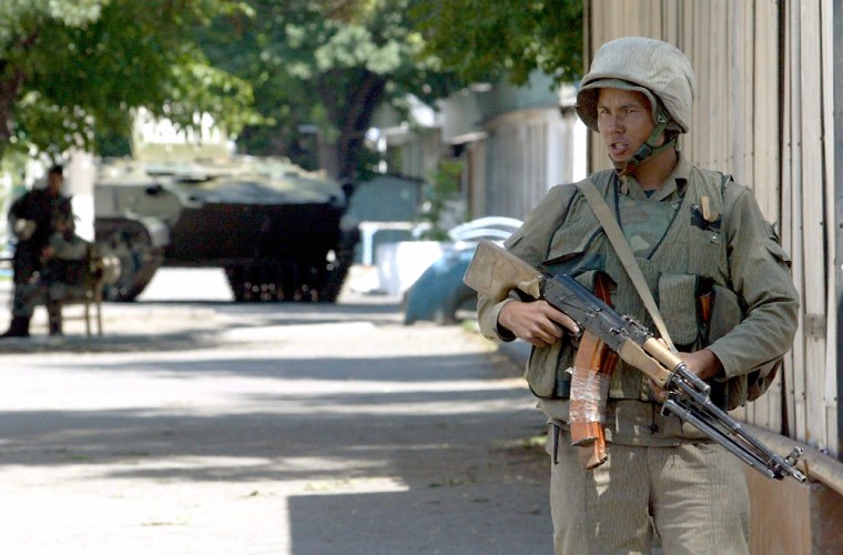 Armed Uzbek soldier patrols in centre of town of Andizhan in eastern Uzbekistan