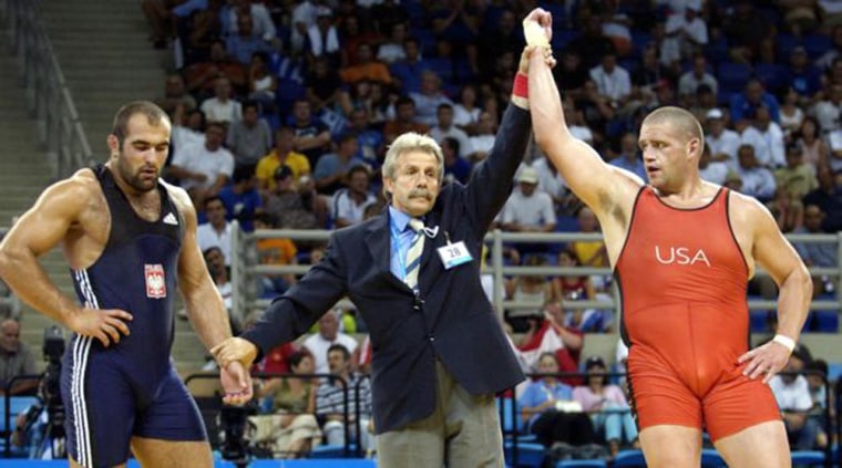 Rulon Gardner of the USA, right, won against Poland's Marek Mikulski during an elimination bout in men's Greco-Roman wrestling event at the 2004 Olympic Games in Athens. Scientists say the "red" effect is subtle, and is probably a deciding factor only among evenly matched competitors.