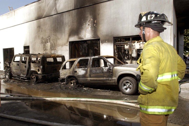 These and other SUVs at a dealership in West Covina, Calif., were destroyed in an August 2003 arson fire. A college student tied to the Earth Liberation Front was sentenced last April to eight years in prison for the crime.