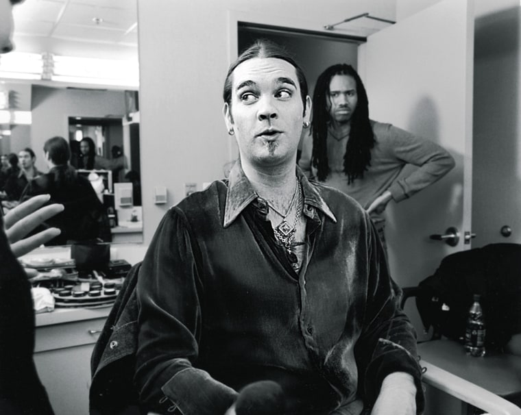 This photo supplied by Life Magazine shows \"American Idol\" finalist Bo Brice with a skeptical look toward stylist Dean Banowetz,left, as he tells him what he wants to do with Bice's signature long hair backstage at the Fox Studios in Los Angeles recently. Life in an issue earlier in May ran a behind-the-scenes article and photos on the Fox talent television show. Bice and his competition Carrie Underwood will perform Tuesday and a winner will be named Wednesday May 25, 2005. (AP Photo/Life Magazine, Alex Tehrani)