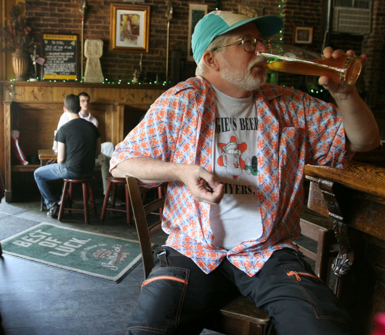 Dan Freeman of Brooklyn, N.Y., drinks a beer at The Gate, a bar in Brooklyn, on May 14. The Gate was the 500th bar he visited in his quest to go to 1,000 bars within a year.