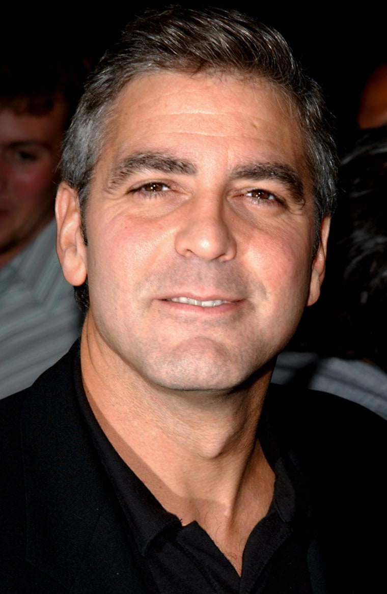 ** FILE  ** Actor George Clooney arrives to the premiere of the film \"Intolerable Cruelty\" at The Academy Theatre, in this Sept. 30, 2003, in Beverly Hills, Calif. Clooney is suffering from a ruptured disk that kept him promoting his new film, \"Ocean's Twelve,\" this week. (AP Photo/ Paul Skipper, File)