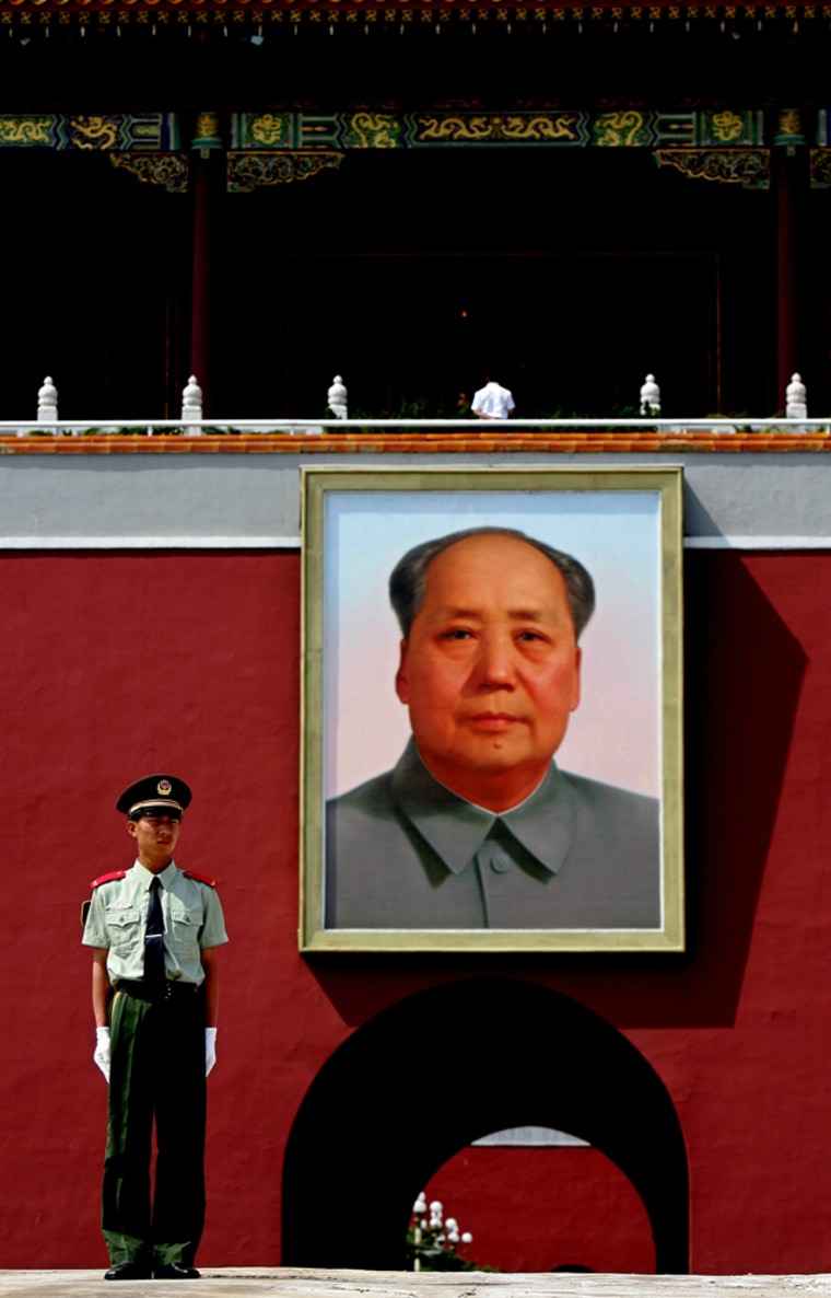 A Chinese paramilitary police officer stands guard in front of the Forbidden City in Beijing