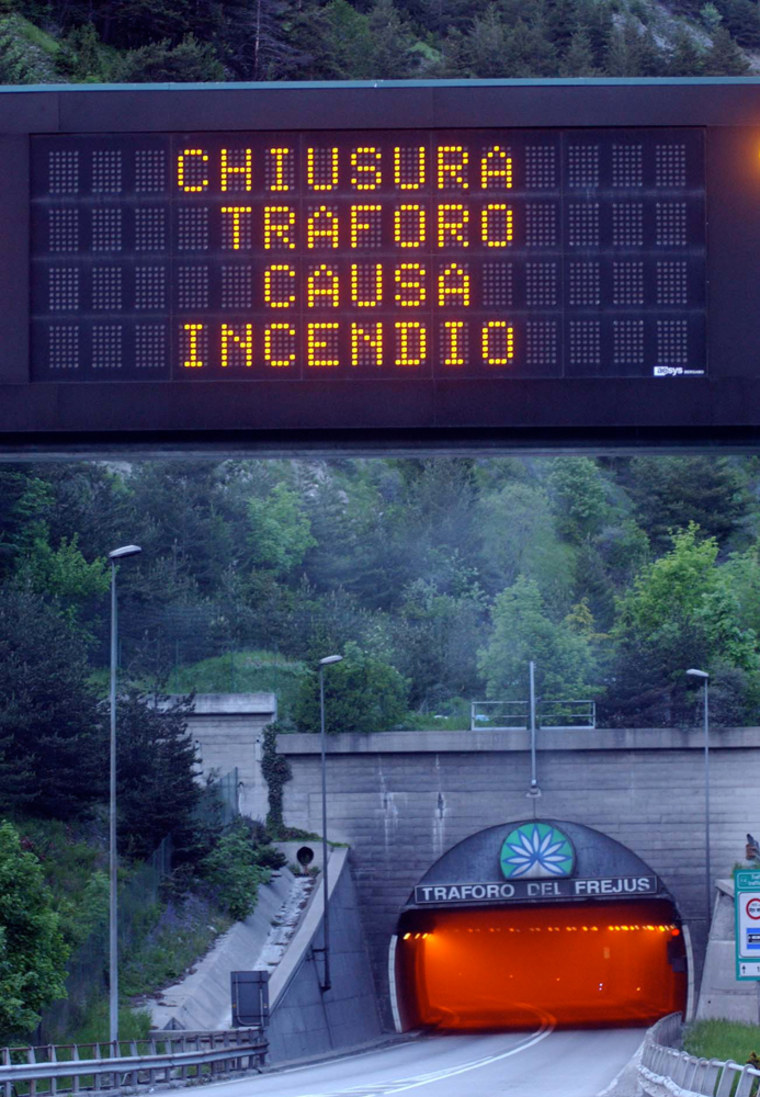 A sign warns “tunnel closing due to fire” on Saturday outside the Italian side of the Frejus Alpine tunnel that links northern Italy with France.