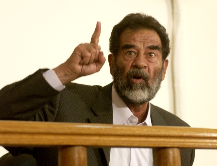 Former Iraqi leader Saddam Hussein appears in court at Camp Victory, on the outskirts of Baghdad, July 1, 2004.