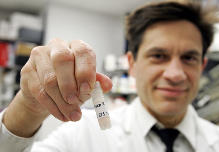 Dr. Robert Kreitman holds a vial of Killian Owen's cells in a lab at the National Institutes of Health, May 18, in Bethesda, Md. Owen was only 9 when he lost an almost 4-year battle with leukemia.