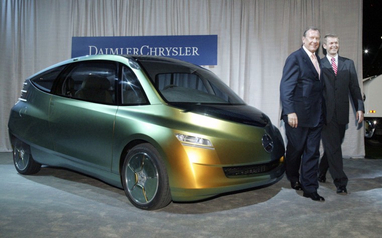 DaimlerChrysler Chairman Juergen Schrempp, left, and Thomas Weber, DaimlerChrysler's head of research, show off the fish-inspired diesel concept car at the company's "Impact on America" event in Washington, D.C., on Tuesday.