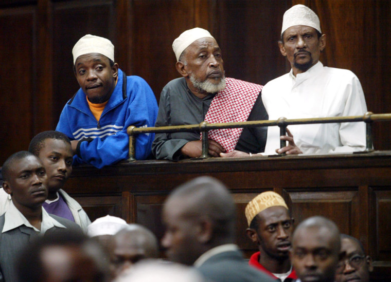 Salmin Mohammed Khamis, left, Said Saggar Ahmed, center, and Kubwa Mohammed Seif listen Monday, June 27 in a Nairobi court as they are acquitted. The three Kenyan men had been charged in an al-Qaida-linked bombing. 
