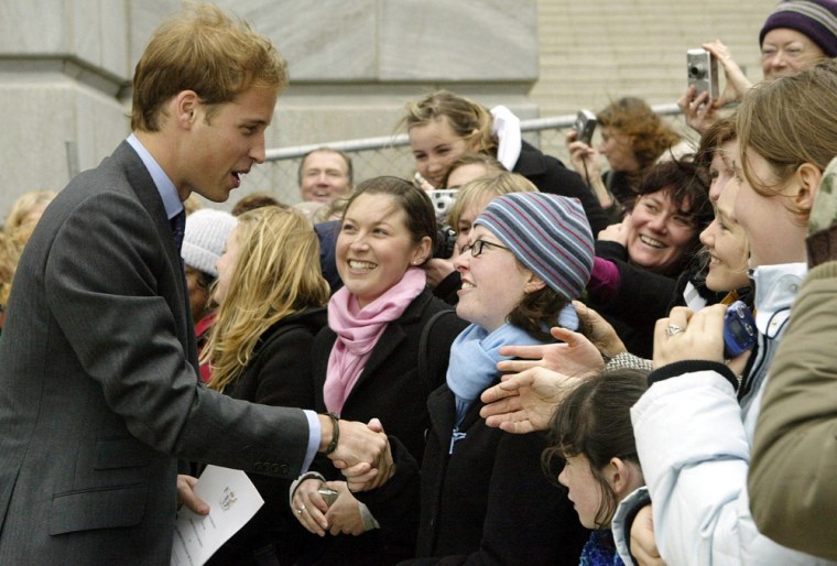 Britain's Prince William shakes hands wi