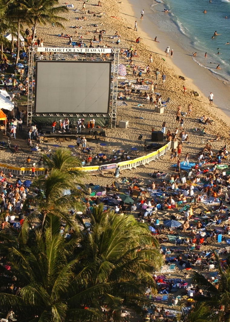 Thousands of people gathered at Waikiki Beach in Honolulu, Hawaii, on Sunday to view a direct NASA feed of the impact on a large screen along with hopes of seeing the event in the sky behind the screen.