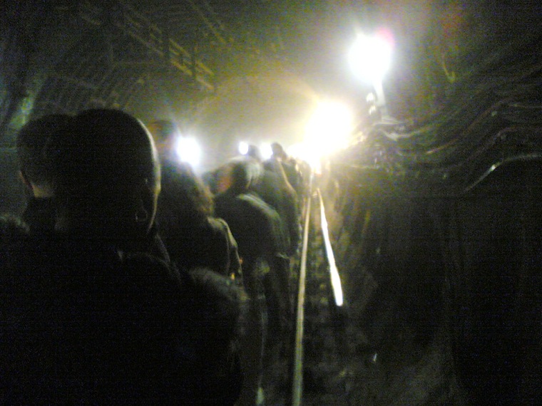 Passengers evacuate a subway train in a tunnel near King's Cross station in central London on Thursday in this image taken by commuter Alexander Chadwick's cell phone camera.