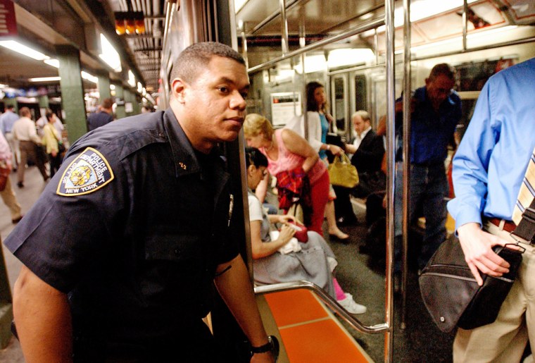 Police officer patrols the New York City subway