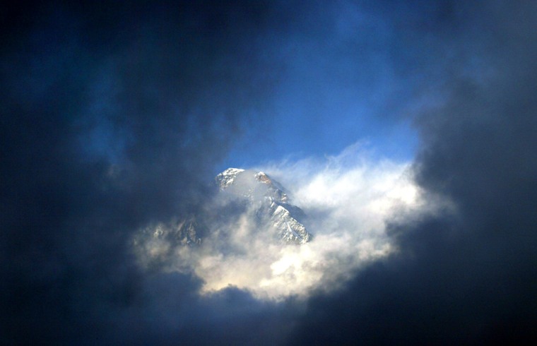File photo of Mount Everest seen through the clouds