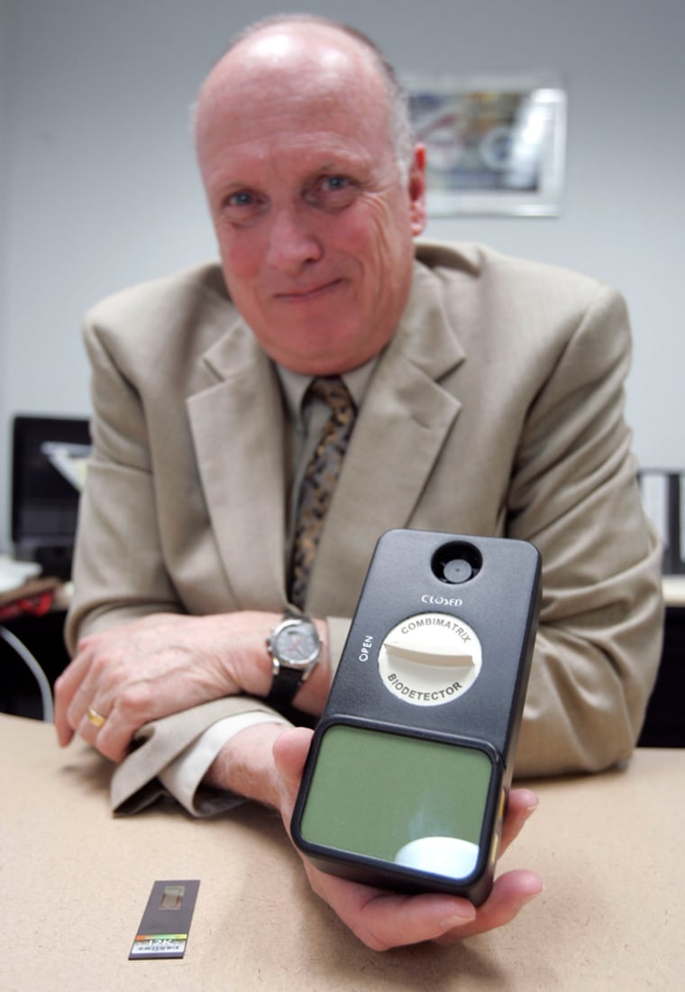 David Danley, head of defense programs at Combimatrix Corp., displays a conceptual model detection system device that can potentially detect pathogens, chemicals and explosives.
