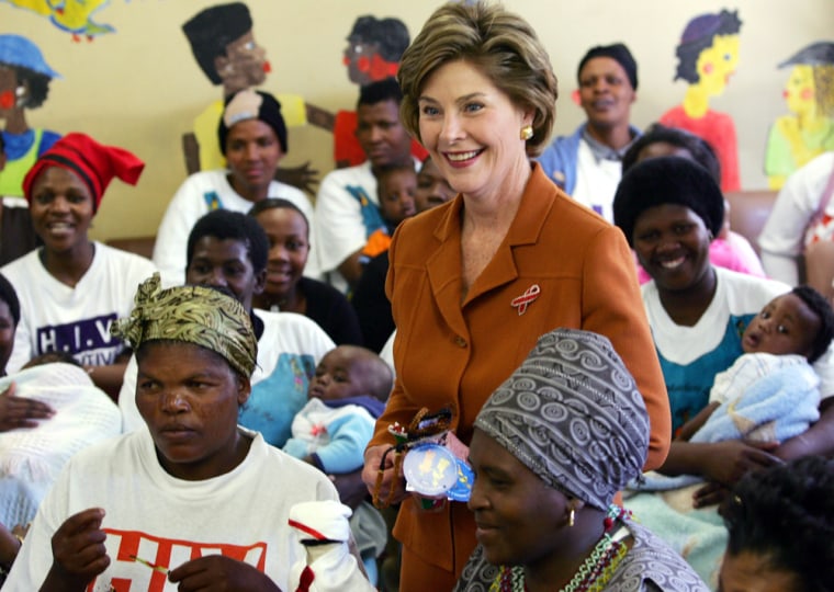 US first lady Laura Bush poses with participants during visit to Aids project in Cape Town's Khayelitsha township
