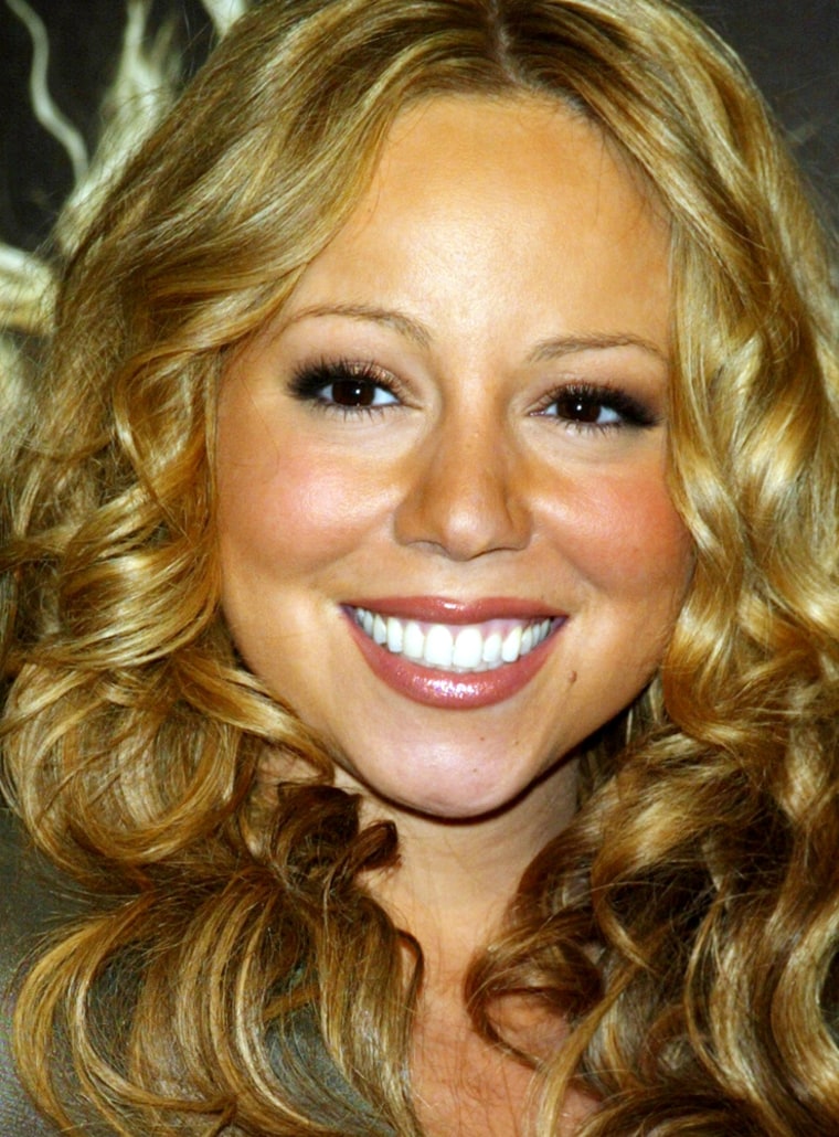 ** FILE **Mariah Carey attends the autograph session for her new CD \"The Emancipation of Mimi,\"  held at Best Buy in New York, in this April 12, 2005, file photo.  (AP Photo/Jennifer Graylock/FILE)