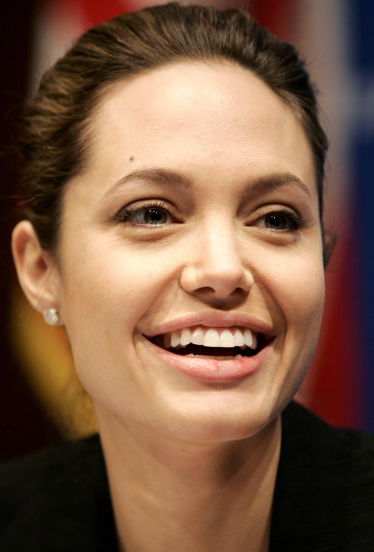 Actress Angelina Jolie laughs as she speaks at the National Press Club in Washington