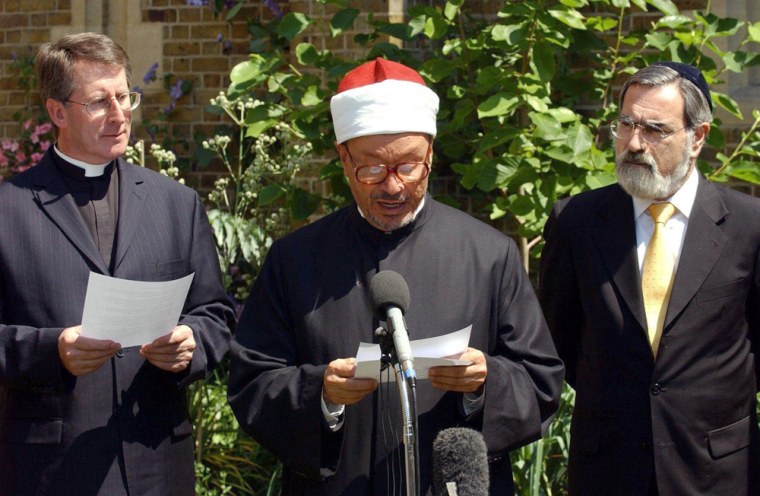 British Muslim leader Zaki Badawi, center, seen here discussing the implications of the London bombings, says he was denied entry to the United States Wednesday with no explanation provided.