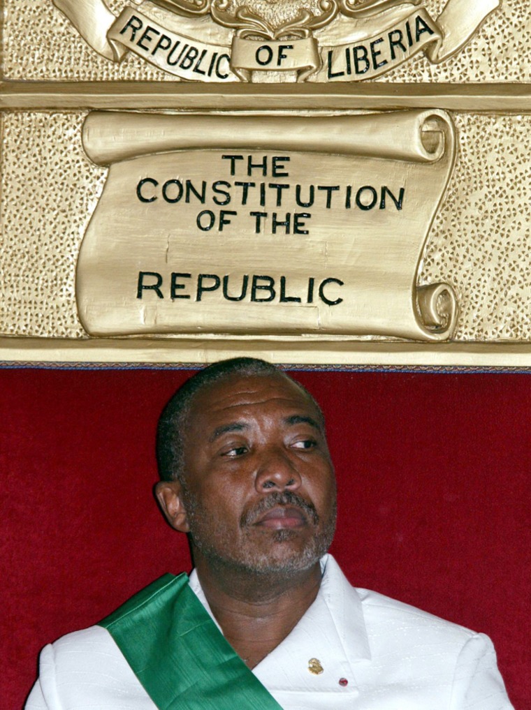 Did former Liberia President Charles Taylor go into business with al-Qaida? In this photo, Taylor waits during the swearing-in ceremony of Liberia's new President Moses Zeh Blah at the presidential palace in Monrovia, Liberia, 11 August 2003. Taylor later boarded a Nigerian government plane that took him into exile. 