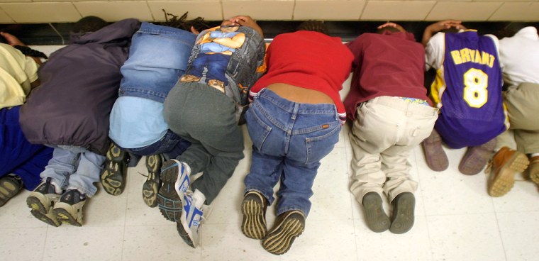 Students at a Richmond, Va., elementary school practicing a 'shelter-in-place' drill in 2003.