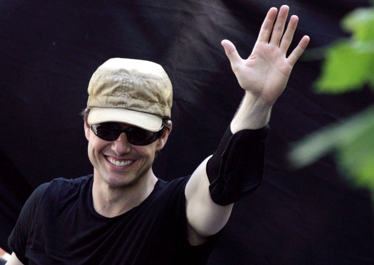 US actor Tom Cruise waves as he leaves t
