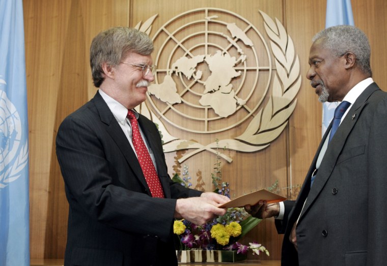 U.S. Ambassador John Bolton, left, presents his credentials to U.N. Secretary General Kofi Annan at U.N. headquarters on Tuesday.
