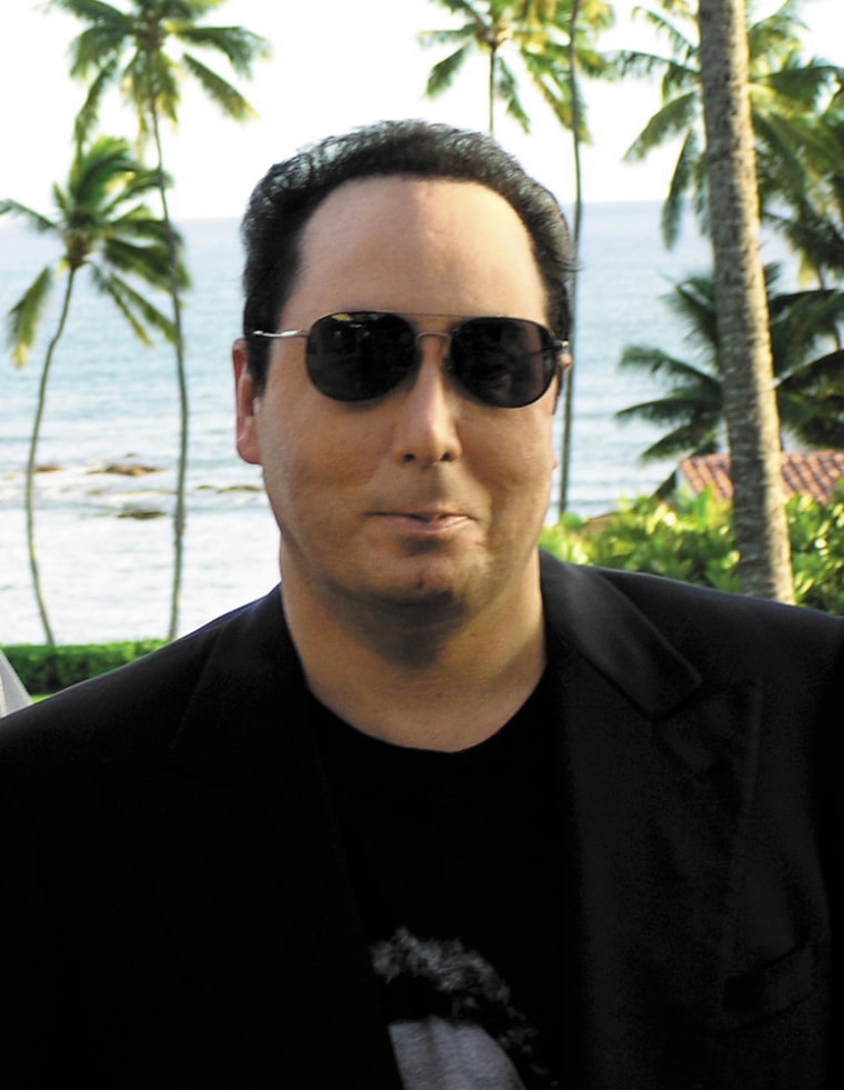 David Gest, the estranged husband of Liza Minnelli, poses at an undisclosed location in Hawaii, in this recent but undated publicity photo.  Gest said, in an interview to be broadcast by NBC Friday, that the breakup of his marriage to Minnelli was caused by a tabloid article, not alleged physical abuse.  Gest, who has been staying in Hawaii since the split, told \"Dateline's\" Stone Phillips that Minnelli \"beat me and hit me everywhere,\" but it was a National Enquirer article portraying his estranged wife as an alcoholic that led to the relationship's end.(AP Photo/NBC)