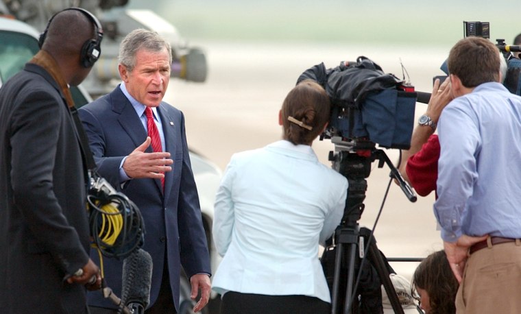 President Bush speaks to the press pool Monday before boarding Air Force One in Waco, Texas, en route to New Mexico.