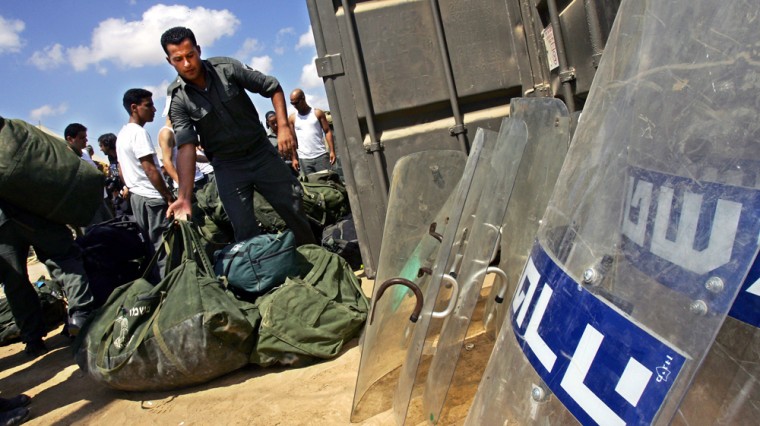 sraeli soldiers take their riot equipmen