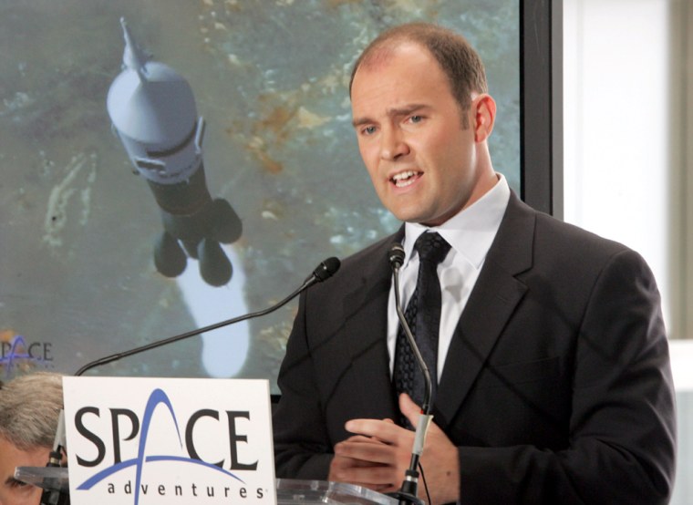 Eric Anderson, president and CEO of Space Adventures Ltd., speaks during a news conference in New York on Aug. 10. Space Adventures, the company that has sent "space tourists" up to the International Space Station, is planning a new mission: rocketing rich people around the dark side of the moon.