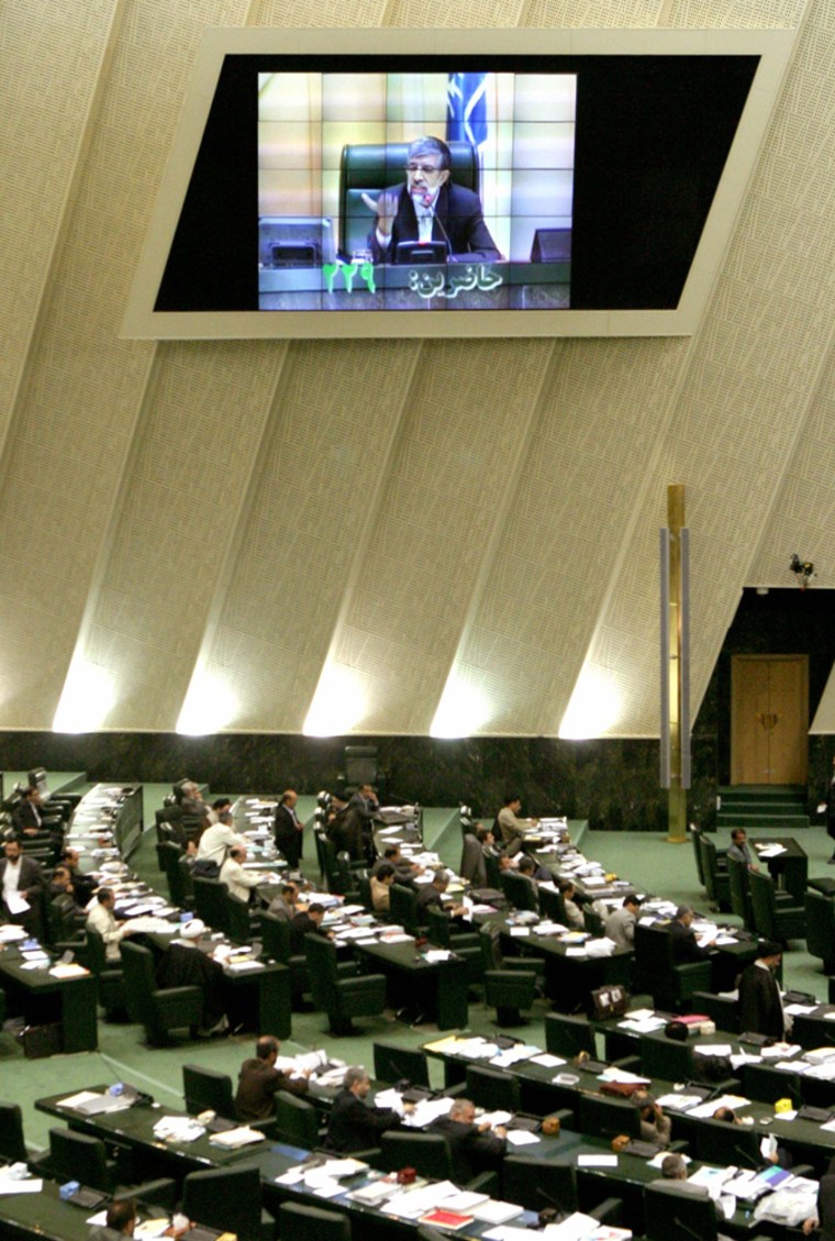 Iranian MPs listen to speech by Speaker Haddadadel in parliament in Tehran